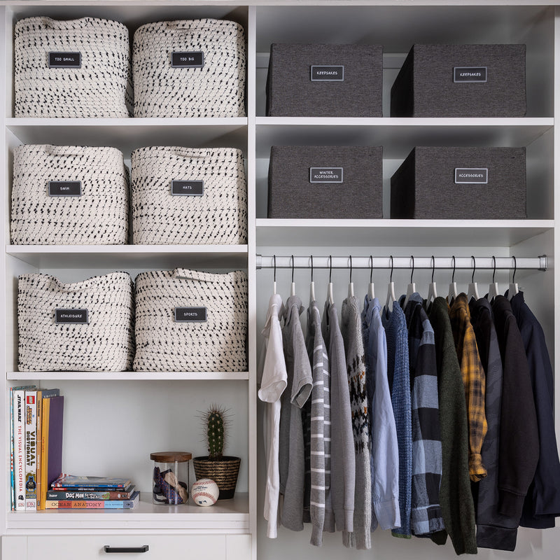 men's closet organized with labeled fabric bins 
