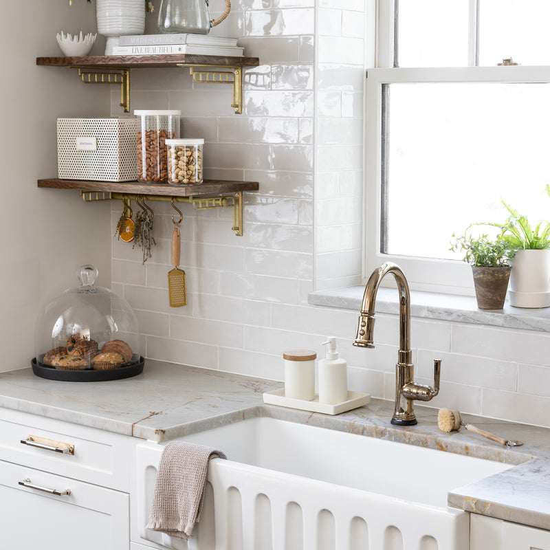 kitchen sink with white ceramic set including tray, jar with wood lid and liquid pump dispenser