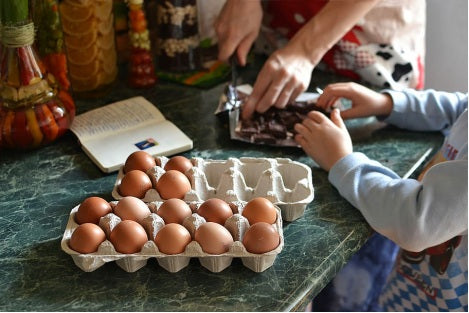 Child helping mother bake