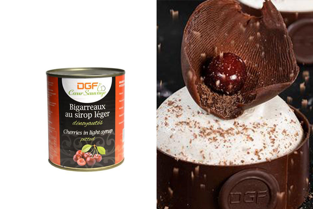 Two images: the left image is of a can labeled "Cherries in light syrup". The right image is of a chocolate cup filled with white mousse, with a large chocolate curl on top and a glazed cherry inside. 