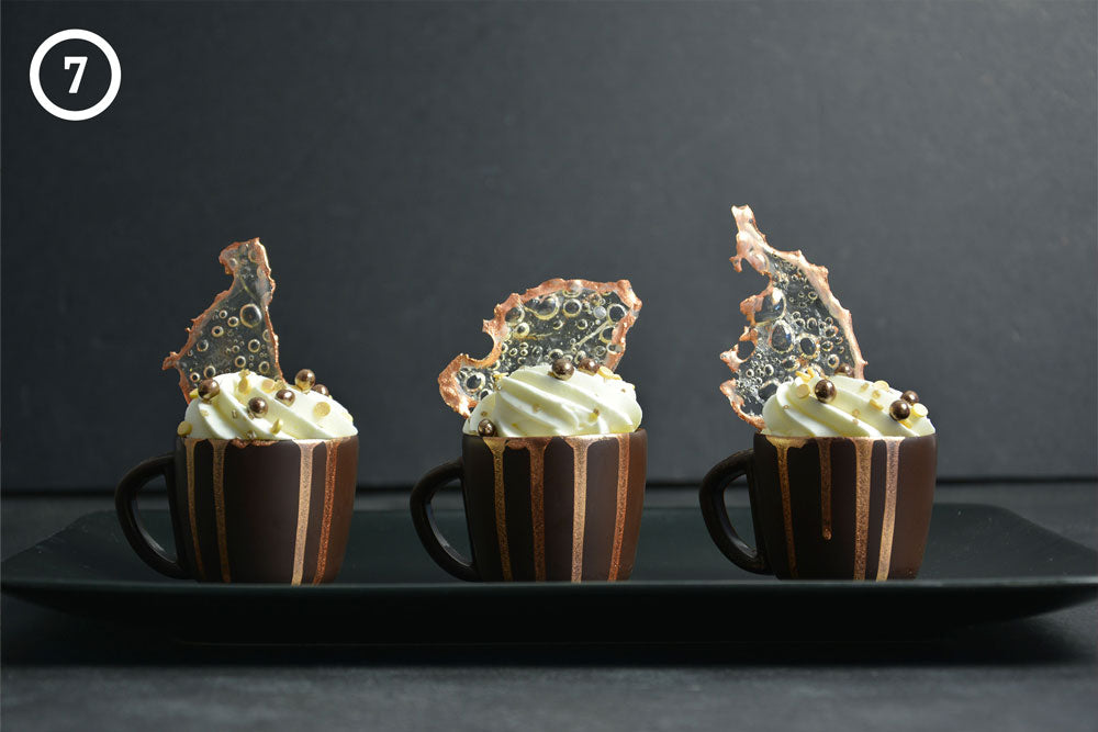 3 chocolate mug mousse cups with carmelized sugar decor. The image is labeled "7" in the upper left corner.