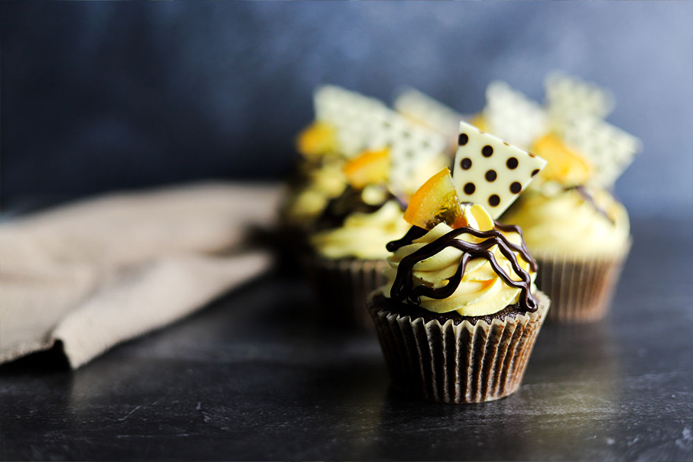 Image of Chocolate Cupcakes with Fond Royal Mousse, decorated with Carrara Punta chocolate plaques