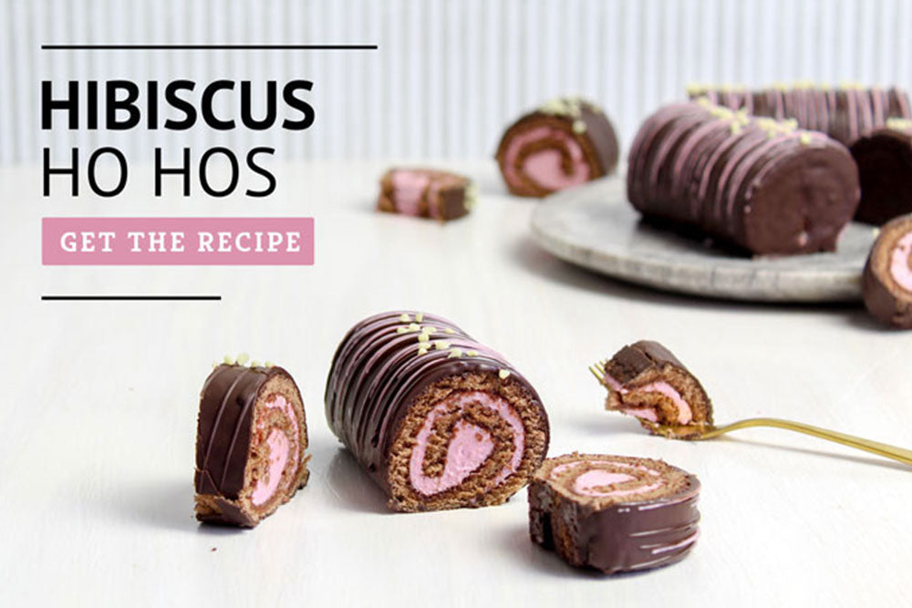 Rolled chocolate ho-hos with hibiscus filling labeled "Hibiscus Ho Hos: Get The Recipe"