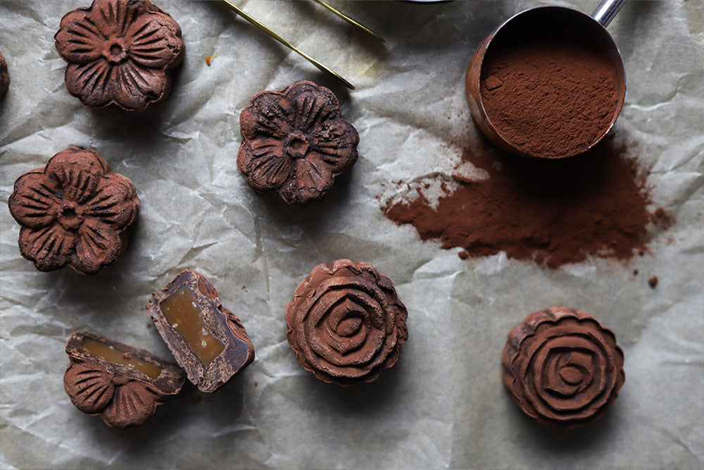 Image of Salted Caramel Mooncakes covered in cocoa powder.