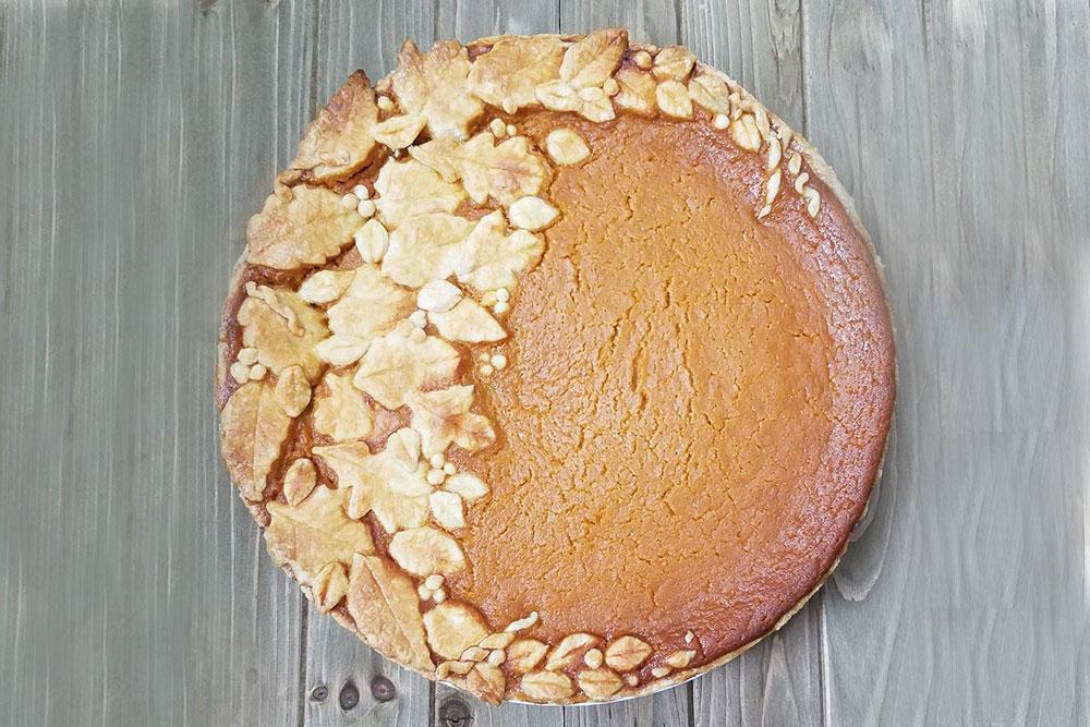 Spiced Sweet Potato pie topped with pie crust foliage. 