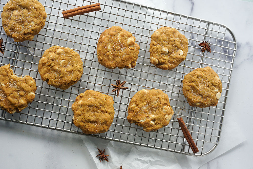 Photo of Pumpkin Spice White Chocolate Cookies on a cooling rack.