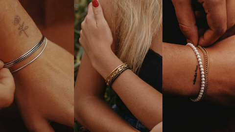 set of stainless steel bracelets on the models wrist