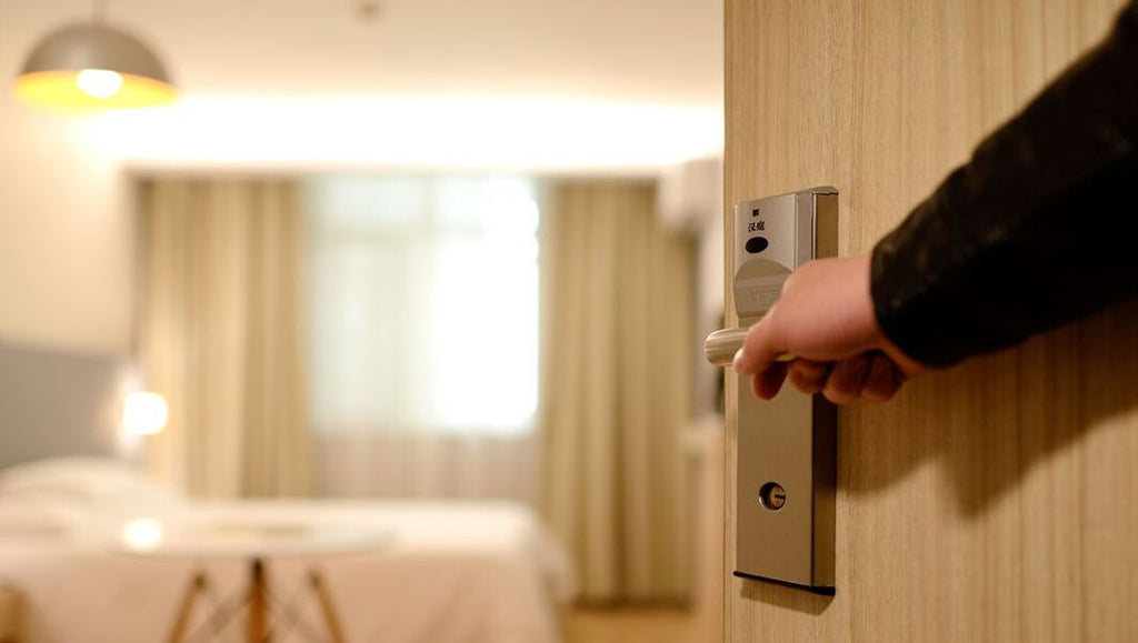 save money on accommodation, hotel door opening