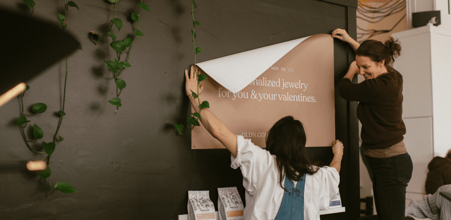 GLDN makers hang sign for popup event