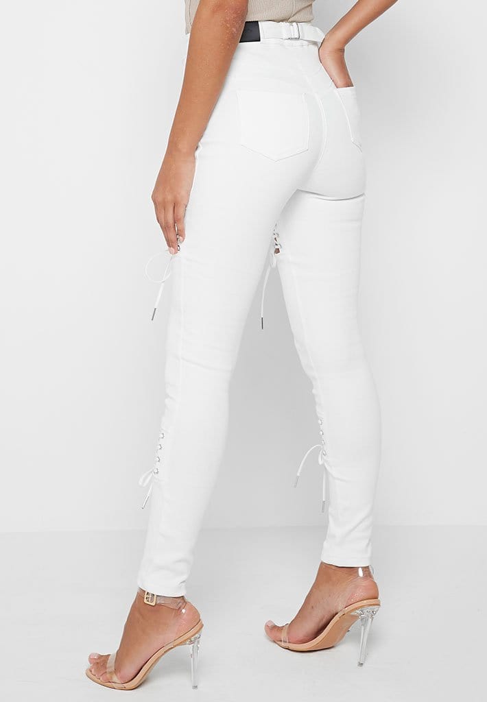 white cut up skinny jeans