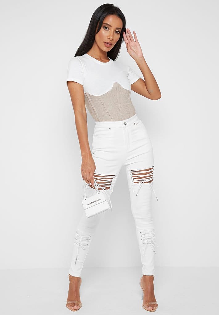 white cut up skinny jeans