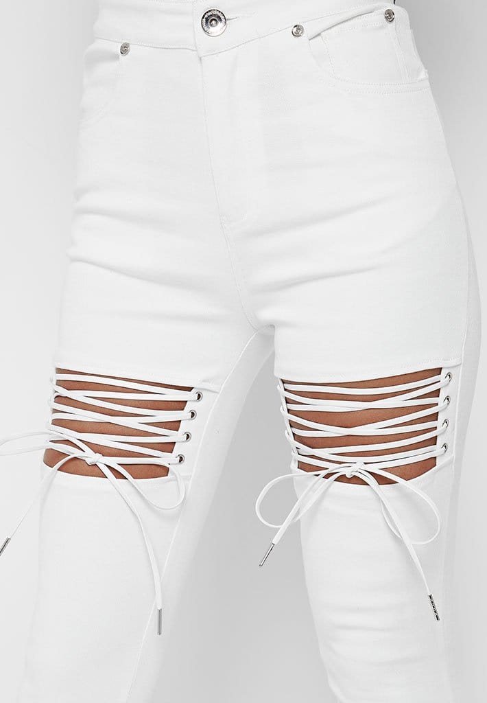 white cut up skinny jeans