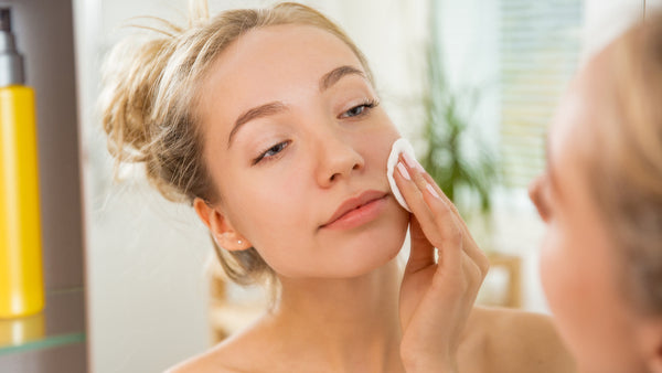 teenage girl washing face