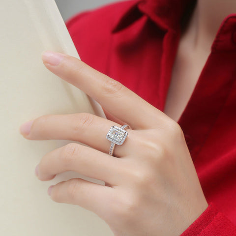Model showcasing the emerald engagement ring