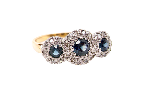 A sapphire and diamond multi cluster ring