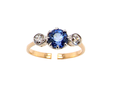 A Three Stone Sapphire And Diamond Ring