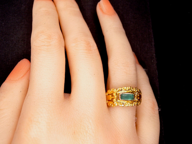 An antique emerald dress ring