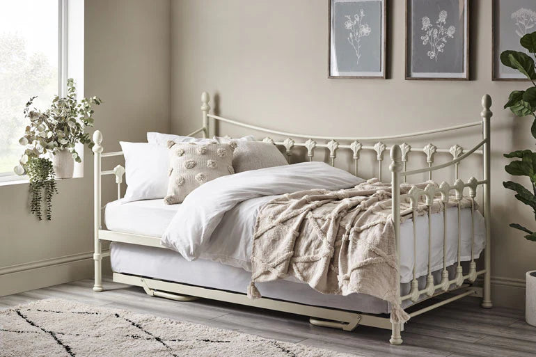  Cream day bed with trundle in a traditional style