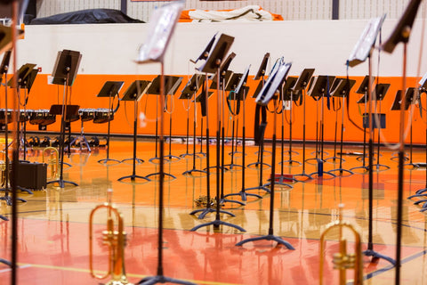 music stands set up for concert in school gym