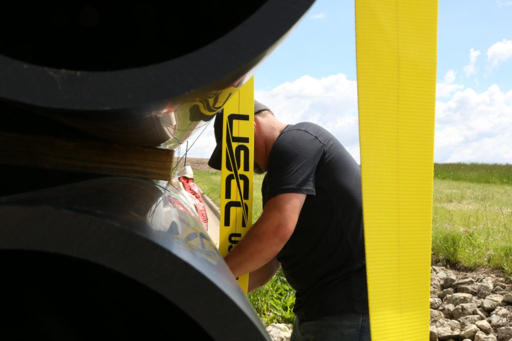 Checking to secure load securement straps