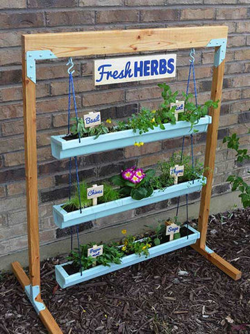 verticle herb garden in upcycled gutters