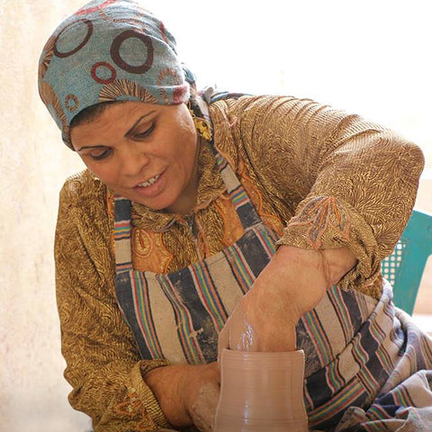 Rawiya at the potter's wheel