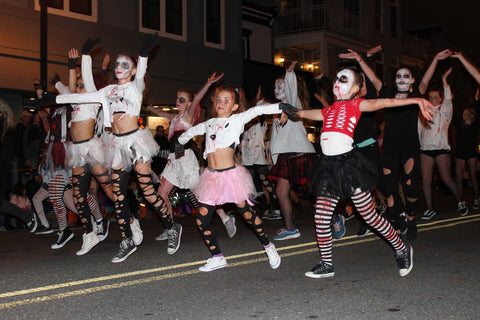 Group of girls dressed as zombies dancing in Halloween Parade