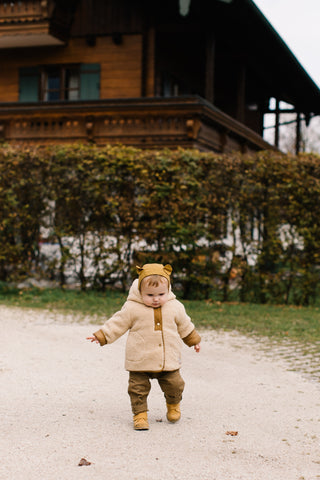 Baby walking outdoors