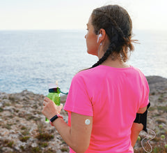 Woman wearing Freestyle Libre 3 on upper arm