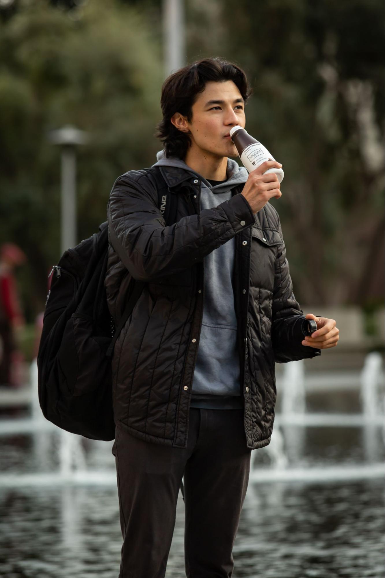 Man drinks protein shake for breakfast.