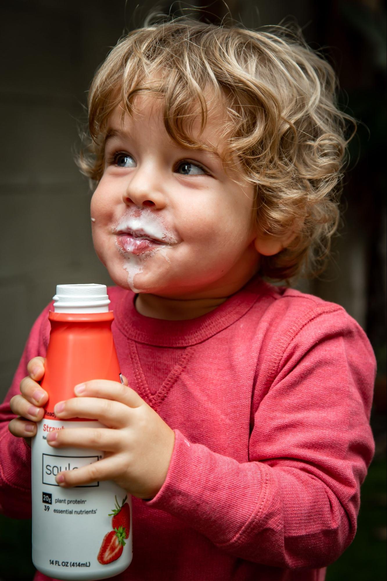 child enjoying sweet soylent