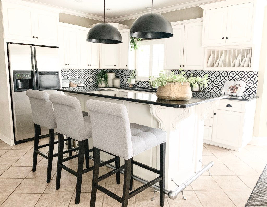 kitchen refresh after photo of white kitchen and black and white backsplash.