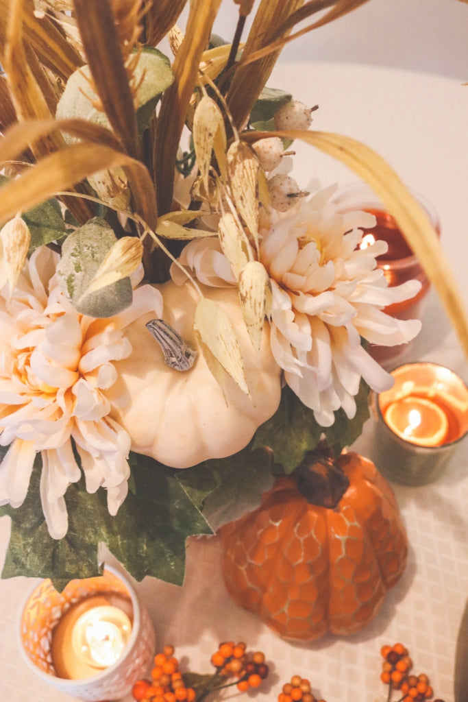 Fall floral arrangement with candles