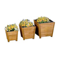 3 sizes of tan wooden planters with flowers