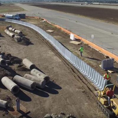 Grey 4' Muscle Wall units installed in San Deigo for stormwater management