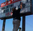 Don't use a ladder to change your sign