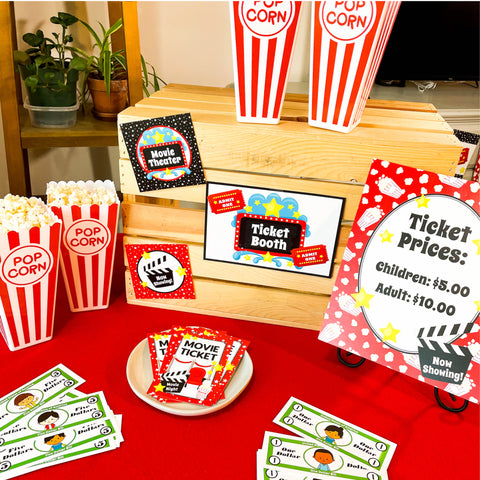 Fun family movie night printables. These include family movie night tickets and concession stand signs. Your kids will love the banner, food tents, and play money.