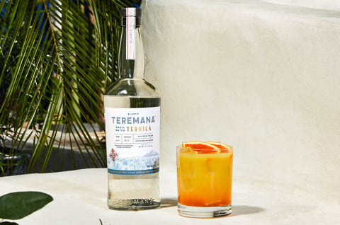 Teremana Sunrise cocktail next to Teremana Blanco bottle