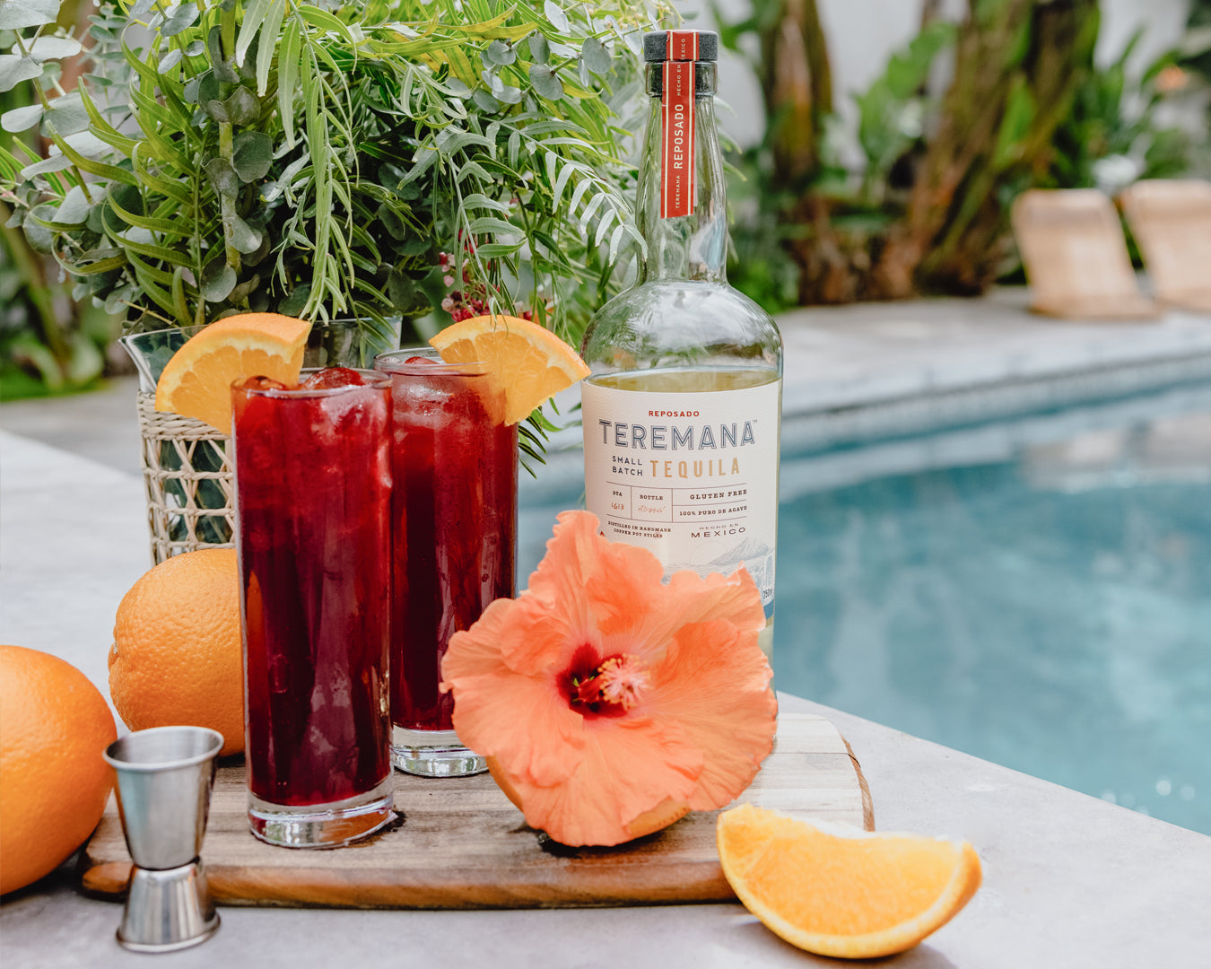 Hibiscus Palmer cocktails in front of Teremana Reposado bottle