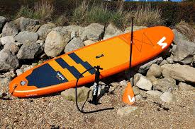 orange SUP with rocks