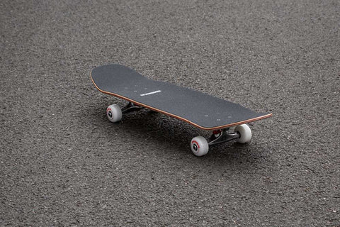 black skateboard on road