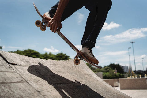 a boy sliding with skateboard