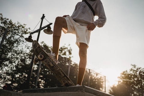 men skating in sunset