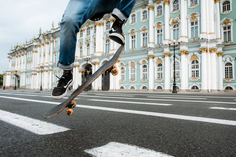 boy skating on a road