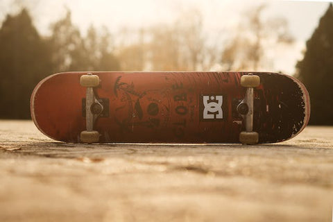 red skateboard in sunset