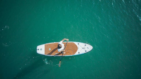 SUP's on greenish clear water