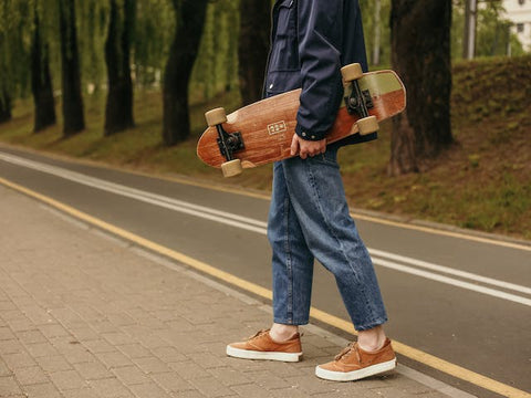 person holding a skateboard