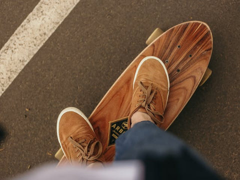 person with brown shoes skating