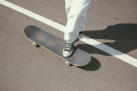 black skateboard on road