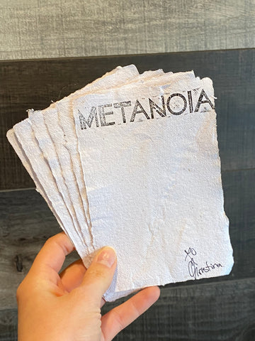 Handmade mould and deckle paper stamped with "Metanoia" and signed "xo Christina"